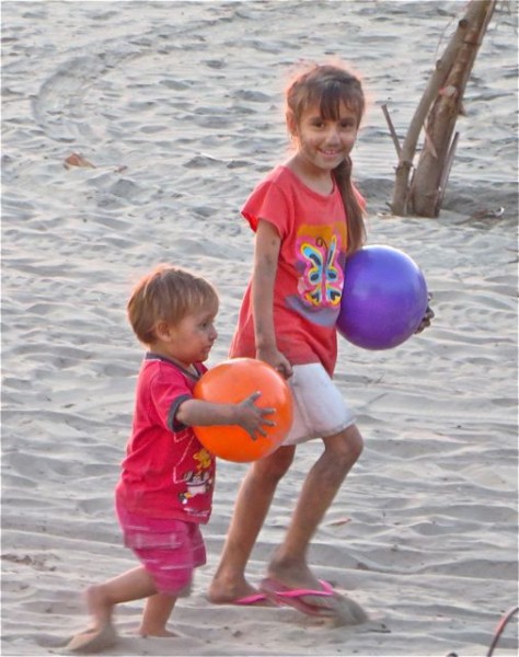 Loved watching thse two kids play with theis mom on the beach just before sudnset.