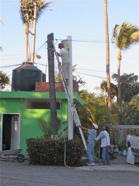 More 'concrete' being poured but not for us.  The RV park is putting in the white tube to hold up the electrical lines.  The tree on the left did the job until it was hit by lightening a few years ago and it is about to fall over.