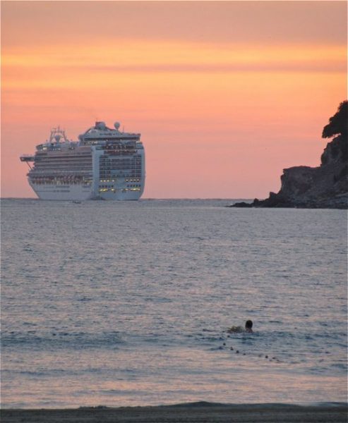 He appears to be swimming out to the ship.